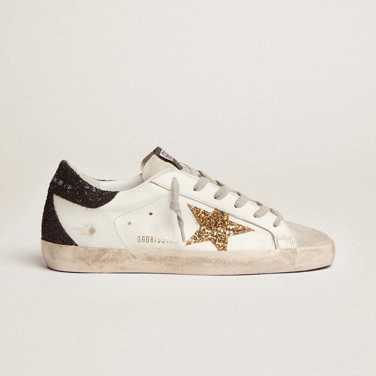 Golden Goose Super-Star in nappa leather with gold glitter star and black glitter heel tab(Women's)
